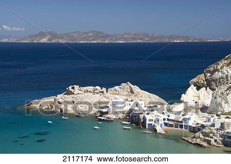 Greece, Cyclades, Island of Milos, Village of Firopotamos, Boats and Buildings near shore. View Large Photo Image Picture - Greece, Cyclades, Island of Milos, Village of Firopotamos, Boats and Buildings near shore.. Fotosearch