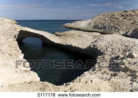 Greece, Cyclades, Island of Milos, Rock formations leading to Kapros beach. View Large Photo Image Stock Photo - Greece, Cyclades, Island of Milos, Rock formations leading to Kapros beach.. Fotosearch