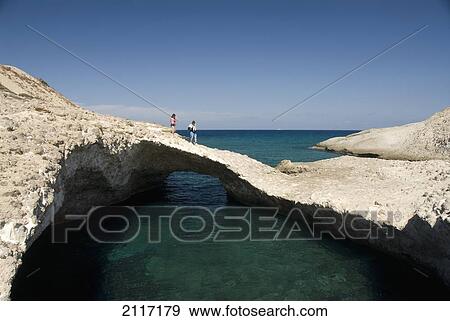 Stock Photo - Greece, Cyclades, Island of Milos, Rock formations leading to Kapros beach.. Fotosearch