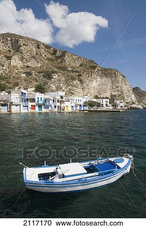 Greece, Cyclades, Island of Milos, Village of Kilma, boats and houses near shore. View Large Photo Image Stock Image - Greece, Cyclades, Island of Milos, Village of Kilma, boats and houses near shore.. Fotosearch