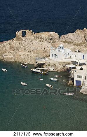 Greece, Cyclades, Island of Milos, Village of Firopotamos, Boats and Buildings near shore. View Large Photo Image Stock Image - Greece, Cyclades, Island of Milos, Village of Firopotamos, Boats and Buildings near shore.. Fotosearch