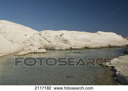 Stock Image - Greece, Cyclades, Island of Milos, Volcanic formations make up Sarakiniko Beach.. Fotosearch