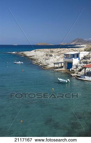 Stock Photo - Greece, Cyclades, Island of Milos, Village of Mitakas, boats and houses near shore.. Fotosearch