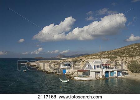 Greece, Cyclades, Island of Milos, Village of Mitakas, boats and houses near shore. View Large Photo Image Stock Photo - Greece, Cyclades, Island of Milos, Village of Mitakas, boats and houses near shore.. Fotosearch
