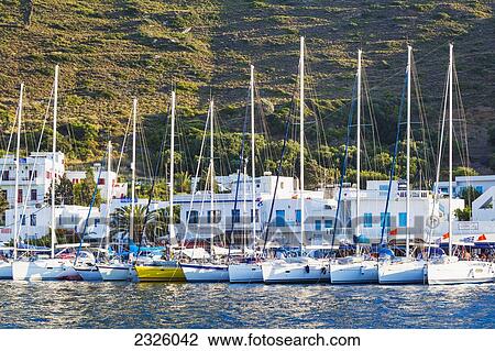 Stock Image - Greece, Greek Islands, Sailboats In Greek Harbor.. Fotosearch