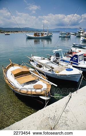 Picture - Greece, Halkidiki, Fishing boats moored in a small harbor; Ierissos. Fotosearch