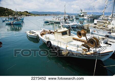 Greece, Halkidiki, Fishing boats moored in a small harbor; Ierissos View Large Photo Image Stock Image - Greece, Halkidiki, Fishing boats moored in a small harbor; Ierissos. Fotosearch