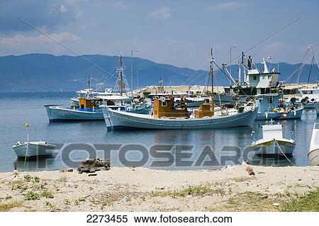 Greece, Halkidiki, Fishing boats moored in a small harbor; Ierissos View Large Photo Image Stock Photography - Greece, Halkidiki, Fishing boats moored in a small harbor; Ierissos. Fotosearch