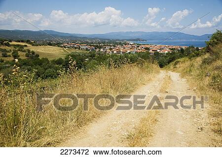 Greece, Halkidiki, Mountain dirt road leading down to the coast from the hills; Ierissos View Large Photo Image Stock Image - Greece, Halkidiki, Mountain dirt road leading down to the coast from the hills; Ierissos. Fotosearch