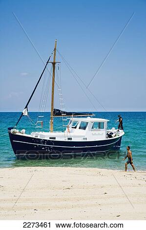 Greece, Halkidiki, New traditional style wooden pleasure boat being launched into the sea outside some boat building premises; Ierissos View Large Photo Image Stock Image - Greece, Halkidiki, New traditional style wooden pleasure boat being launched into the sea outside some boat building premises; Ierissos. Fotosearch