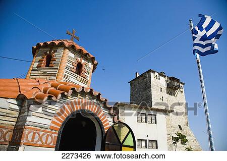 Stock Photograph - Greece, Halkidiki, Orthodox Greek church next to the Byzantine Tower or Tower of Prosforios; Ouranoupoli. Fotosearch