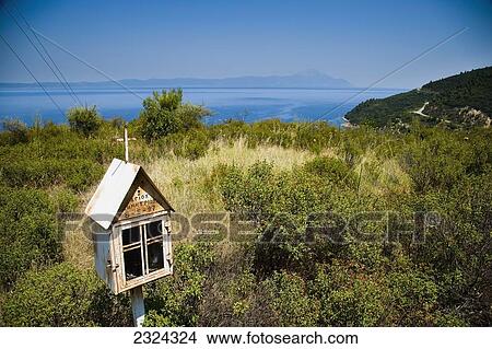 Greece, Halkidiki, Rusty miniature church roadside shrine with Mount Athos in distance; Sithonia View Large Photo Image Picture - Greece, Halkidiki, Rusty miniature church roadside shrine with Mount Athos in distance; Sithonia. Fotosearch