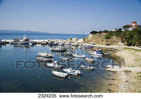 Greece, Halkidiki, Small traditional fishing boast moored in harbour; Nea Roda View Large Photo Image Stock Photography - Greece, Halkidiki, Small traditional fishing boast moored in harbour; Nea Roda. Fotosearch