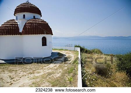 Greece, Halkidiki, Whitewashed Greek Orthodox church overlooking Mediterranean sea; Nea Roda View Large Photo Image Stock Photo - Greece, Halkidiki, Whitewashed Greek Orthodox church overlooking Mediterranean sea; Nea Roda. Fotosearch