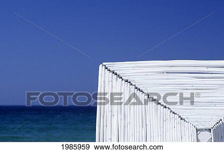 Stock Photo - Greece, Mykonos, View Of Beautiful Blue Ocean From White Building.. Fotosearch