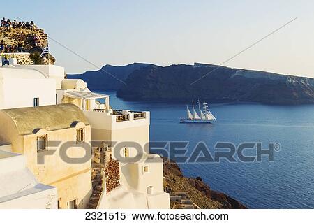 Greece, Santorini, Large Ship Sailing Into The Santorini Caldera At Sunset. View Large Photo Image Stock Photography - Greece, Santorini, Large Ship Sailing Into The Santorini Caldera At Sunset.. Fotosearch