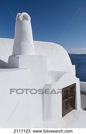 Greece, Santorini, Oia, Architectural detail of Greek Orthodox Chrurch, Mediterranean Sea and Island of Thirassia in the distance. View Large Photo Image Stock Image - Greece, Santorini, Oia, Architectural detail of Greek Orthodox Chrurch, Mediterranean Sea and Island of Thirassia in the distance.. Fotosearch