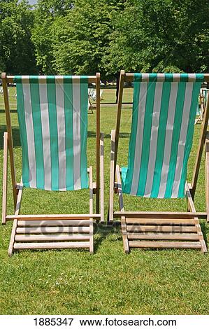 Stock Photo - Green And White Striped Deckchairs In Hyde Park. Fotosearch
