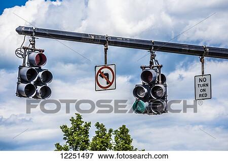Green traffic light hanging next to no-turn signs; Connecticut, United States of America View Large Photo Image Stock Photo - Green traffic light hanging next to no-turn signs; Connecticut, United States of America. Fotosearch