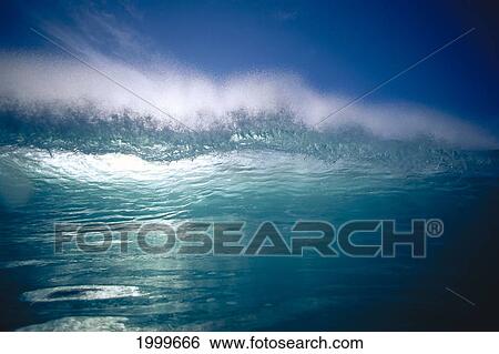 Green Wave With Wind Spray At Tips, Backlit With Reflections On Water, Blue Sky C1719 View Large Photo Image Stock Photograph - Green Wave With Wind Spray At Tips, Backlit With Reflections On Water, Blue Sky C1719. Fotosearch
