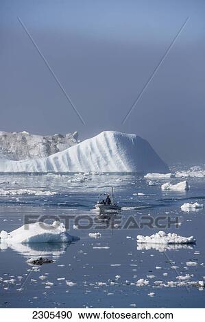 Stock Image - Greenland, Icefjord; Ilulissat (Jakobshavn), Unesco World Heritage Site, Fishermen going out to sea. Fotosearch