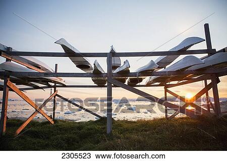 Stock Image - Greenland, Icefjord; Ilulissat (Jakobshavn), Unesco World Heritage Site, Kayaks on shoreline. Fotosearch