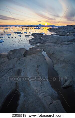 Greenland, Icefjord; Ilulissat (Jakobshavn), Unesco World Heritage Site, The shoreline at sunset View Large Photo Image Stock Photo - Greenland, Icefjord; Ilulissat (Jakobshavn), Unesco World Heritage Site, The shoreline at sunset. Fotosearch