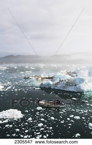 Greenland, Icefjord; Ilulissat, Fishermen going out to sea at Unesco World Heritage Site View Large Photo Image Stock Photo - Greenland, Icefjord; Ilulissat, Fishermen going out to sea at Unesco World Heritage Site. Fotosearch