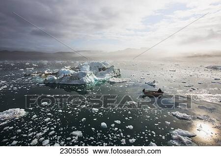 Stock Photography - Greenland, Icefjord; Ilulissat, Fishermen going out to sea at Unesco World Heritage Site. Fotosearch