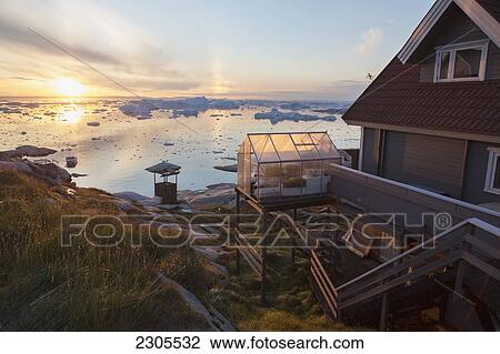 Stock Image - Greenland, Unesco World Heritage Site; Ilulissat, Colorful houses and icefjord. Fotosearch