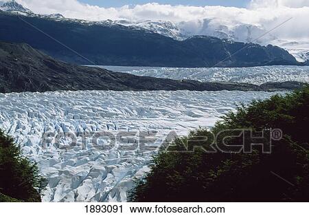 Stock Image - Grey Glacier Spilling Ice Cap. Fotosearch