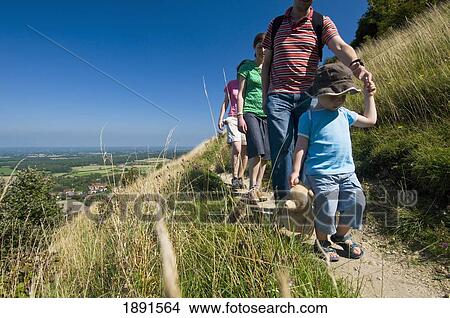 Picture - Group Of Adults With Boy, Walking Along Path At Devil's Dyke Near Brighton. Fotosearch