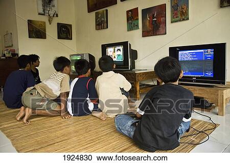 Stock Image - Group Of Boys Playing Video Games. Fotosearch
