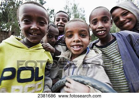 Stock Photograph - Group of excited young boys; Ethiopia. Fotosearch