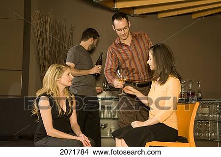 Group Of Friends Having Drinks, Toronto, Ontario View Large Photo Image Picture - Group Of Friends Having Drinks, Toronto, Ontario. Fotosearch