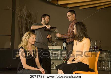 Stock Image - Group Of Friends Having Drinks, Toronto, Ontario. Fotosearch
