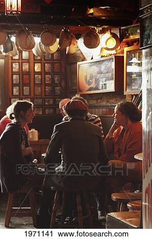 Group Of People Chatting In De Barra's Pub; Clonakilty County Cork Ireland View Large Photo Image Stock Image - Group Of People Chatting In De Barra's Pub; Clonakilty County Cork Ireland. Fotosearch