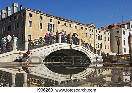 Group Of Tourists On Bridge Over Canal, Venice, Italy View Large Photo Image Stock Image - Group Of Tourists On Bridge Over Canal, Venice, Italy. Fotosearch