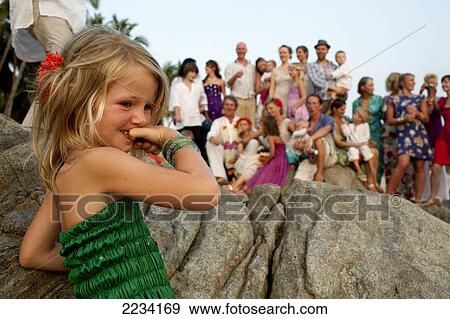 Group shot of the wedding wedding party on a rock, Patnum beach, Goa, India. View Large Photo Image Stock Photo - Group shot of the wedding wedding party on a rock, Patnum beach, Goa, India.. Fotosearch