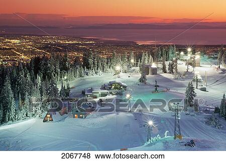 Stock Photo - Grouse Mountain ski run at sunset; North Vancouver, British Columbia, Canada. Fotosearch
