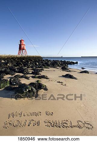 Stock Photograph - Groyne Lighthouse And Nearby Beach. Fotosearch