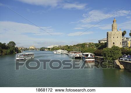 Stock Image - Guadalquivir, Torre Del Oro; Torre Del Oro, Seville, Spain. Fotosearch