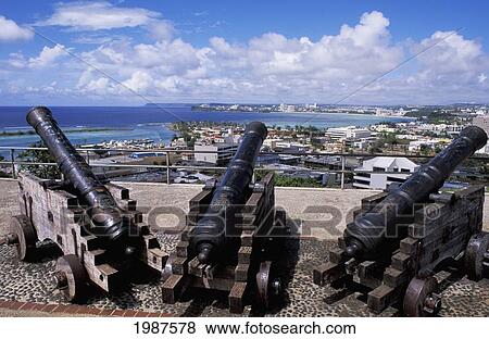 Guam, Hagatna (Agana), Fort Santa Agueda, Old Cannons Overlooking City And Coast. View Large Photo Image Stock Photo - Guam, Hagatna (Agana), Fort Santa Agueda, Old Cannons Overlooking City And Coast.. Fotosearch