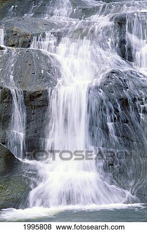 Stock Photo - Guam, Talofofo Falls, Closeup Of Falls Rushing Through Rocks Into Pool. Fotosearch