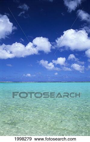 Stock Photo - Guam, Tumon Bay, Beautiful Turquoise Water, Blue Skies And White Puffy Clouds B1465. Fotosearch