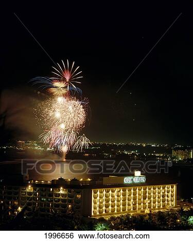 Stock Photograph - Guam, Tumon Bay, Hilton Hotel At Night, Fireworks Over Marianas Background A60F. Fotosearch