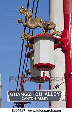 Stock Photo - Guangzhou Alley Street Sign And Chinese Lamps In Chinatown, Vancouver, British Columbia, Canada. Fotosearch