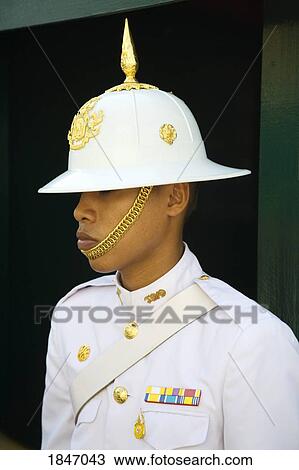 Stock Image - Guard At Royal Grand Palace In Rattanakosin District; Bangkok, Thailand. Fotosearch