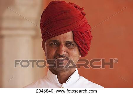 Stock Image - Guard At The City Palace, Jaipur, Rajasthan, India. Fotosearch