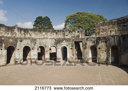 Stock Image - Guatemala, Antigua, the ruined convent of Las Capuchinas, a circular pattern of small sleeping cells for nuns.. Fotosearch